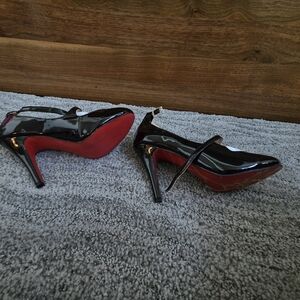 Elegant Black Stiletto Heels with Red Soles